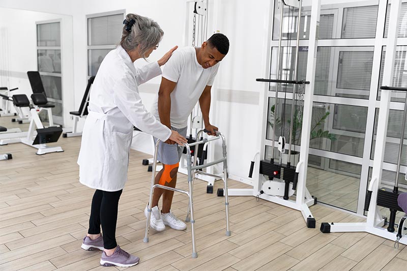Gilbert Law Firm - Trusted Motorcycle Accident Attorney Deer Park WA - Rider with Leg Injury in Physical Therapy